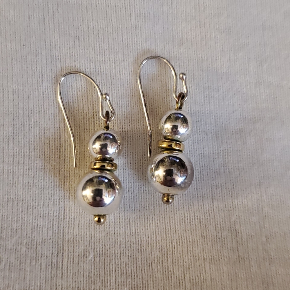 Silver tone earrings with gold tone accent